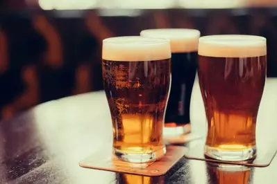 glasses of beer on table in bar