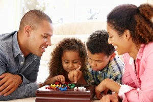 family playing board game in condo rentals Pigeon Forge TN