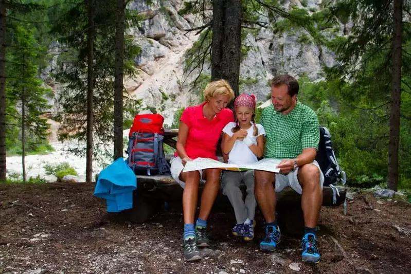 Family planning a hike in the mountains